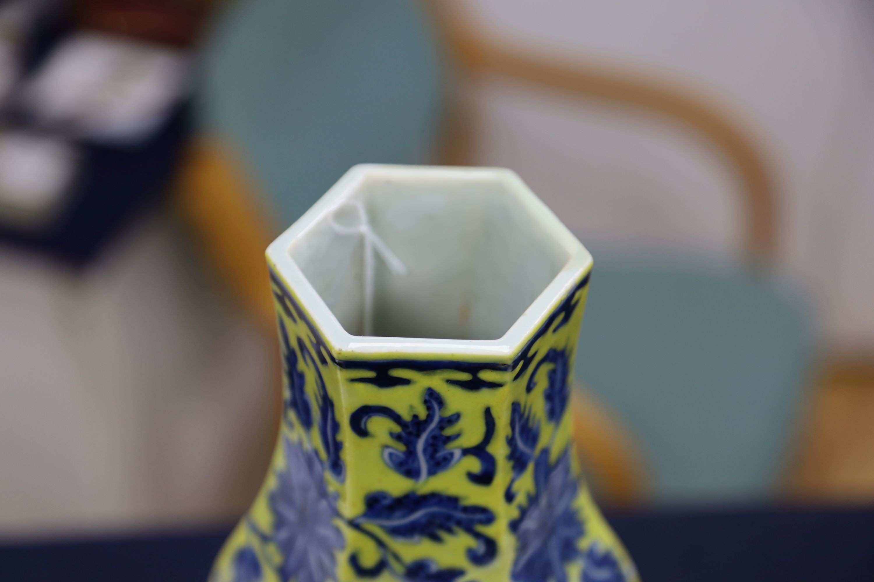 A Chinese underglaze blue yellow ground hexagonal vase, early 20th century, some restoration 35cm